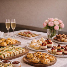 Load image into Gallery viewer, finger food, dessert, glass of champagne and flowers.